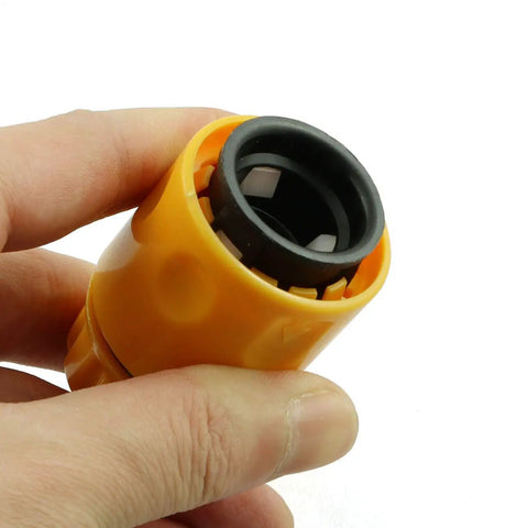 Close-up of a yellow ABS plastic fitting from the Two Pack Half Inch Garden Hose Repair Kit With No Fuss Quick Connect Fittings.