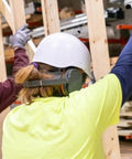 Worker wearing Behind-The-Head Ear Muffs With 25dB NRR Hearing Protection For Construction, Manufacturing, Maintenance And Woodworking
