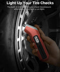 ETENWOLF T300 Plus handheld digital tire gauge in vivid orange with LED display near tire valve