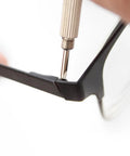 Close-up of a flathead screwdriver from 3-In-1 Eyeglass And Watch Repair Kit With Mini Screwdriver Set For On The Go Fixes adjusting eyeglass frame