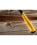 ToughSeries 22 Oz Demo Hammer With Magnetic Nail Starter handle resting on wooden boards, highlighting its durable grip.