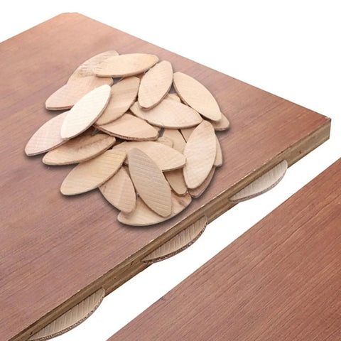 100 Piece Pack Beech Wood Joining Biscuits Deliver Rock Solid Bonds When Gluing Wooden Boards Together While Making Carpentry Work Dead Simple With Every Biscuit Joiner on wood surface.