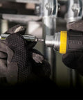 Close-up of hands using Compact Six In One Stubby Ratcheting Screwdriver With Phillips And Slotted Bits Plus One Quarter Inch And Three Sixteenth Inch Nut Drivers Cushioned Grip For Maximum Torque And Comfort Pro Grade Ideal For Tight Spots From Klein Tools.