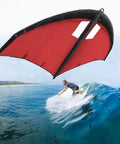 Inflatable Wing With Pump For Paddle Board And Hydrofoil, Wing Foil Kite For Windsurfing, Portable Water Sports Wing, red in use over ocean
