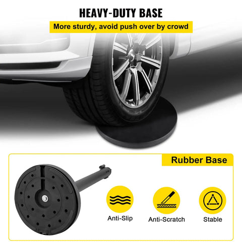 Rubber base of Six Piece Crowd Control Stanchion Set with 6.6 Feet Red Retractable Belt shown under car tire for stability demonstration.