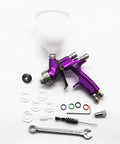 Nail That Sweet Factory Finish With This Top Shelf Air Powered Paint Spray Gun, 1.3mm nozzle, purple with accessories on white background.