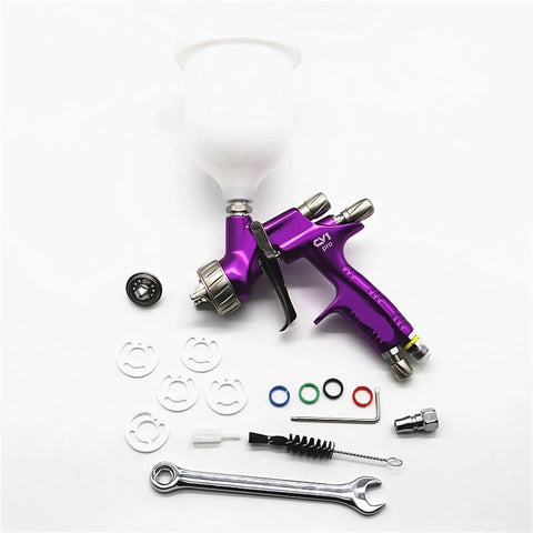 Nail That Sweet Factory Finish With This Top Shelf Air Powered Paint Spray Gun, 1.3mm nozzle, purple with accessories on white background.