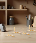 Gold Finish 92 Degree Quadrant Hinges for Jewelry Boxes and Small Cabinets on a workbench