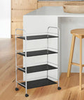 4pcs Inch Plastic Swivel Caster Wheels Replacement for Desk Chair on a metal shelving unit with black shelves.