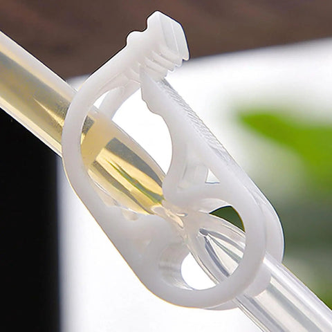 Close-up of a white adjustable plastic tubing clamp on clear tubing, 24 Pack Adjustable Plastic Tubing Clamps For Quarter To Half Inch Tubing
