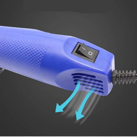 No Sweat Mini Heat Gun For Epoxy Resin And Crafts 300W Portable Handheld Dryer Tool For Embossing Shrink Wrapping Paint Clay Rubber Stamps Quick Dry Blue close-up of power switch and air vents.