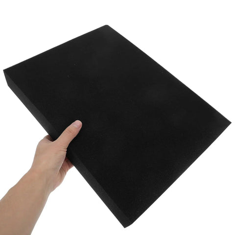 Hand holding a piece of black craft foam from 4 Pack Easy Tear Sponge Foam Inserts For Protective Packaging Cushioning For Shipping Storage And Fragile Item Movement Ship Safe Packaging Black Craft Foam Blocks For DIY Padding And Secure Packaging