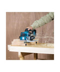 Badass Brushless Cordless Planer With 18v Lithium Power And An 82mm Precision Cutting Width For Sleek Finish Work Job Site Ready Bare Tool Build in use, smoothing wood with sawdust flying.