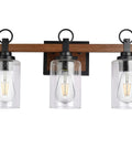 Farmhouse 3 Light Vanity Fixture With Seeded Glass Shades Black Rustic Wall Sconce For Bathroom And Bedroom Over Mirror Mount Vintage Style Bath Lighting Vibe shown with imitation wood accents and Edison bulbs.