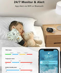 Child sleeping with teddy bear, phone displaying air quality alerts, and smart air monitor on nightstand with LED display.