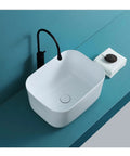 USZWBY Bathroom Vessel Sink White Bathroom Sink Fillet Deepen Basin Design Ceramic Vessel Sink Art Basin Above Counter Bathroom Sink on teal countertop with towel.