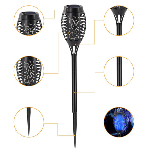 Blue Outdoor Solar Torch Lights 12 Pack With Flickering Flame Waterproof Mini Tiki Torches for garden and pathway lighting, close-up view.