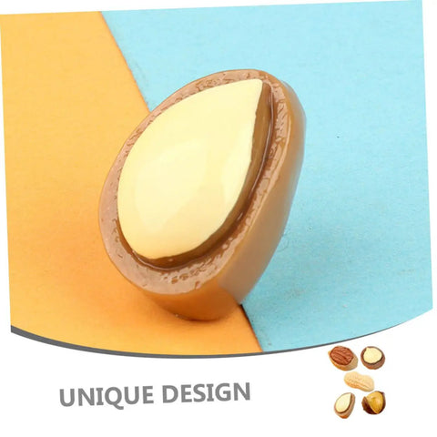 Close-up of Miniature Resin Nut Ornaments Set For Dollhouse Food Decor, showing a realistic nut model on a colorful background.