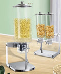 No Fuss Count Controlled Cereal Dispenser And Nut Storage Container Airtight Dry Food Jar With Smooth Twist Dial, large clear jars on a chrome base.