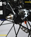 Close-up of Ultra Lightweight Titanium Quick Release Skewers Set installed on a road bike disc wheel hub.