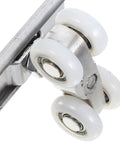 Close-up of heavy duty wheels from Top Notch Two Piece Stainless Steel Barn Door Roller Hardware for smooth sliding.