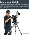 Man adjusting StarSense Explorer 114AZ App Enabled Telescope for Beginners on a tripod, demonstrating setup height flexibility.