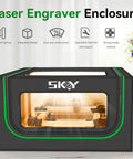 SKOY laser engraver enclosure with LED light; black housing with green trim and front window, front view