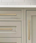 5 Pack Brushed Brass Cabinet Pulls Zinc Alloy Die Cast Modern Minimalist Hardware on gray kitchen cabinets, 4.75 inch length.