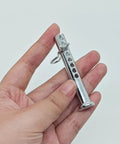 Hand holding heavy duty adjustable clevis pin with R clip set three eighths inch diameter and two and one half inches length eight position holes