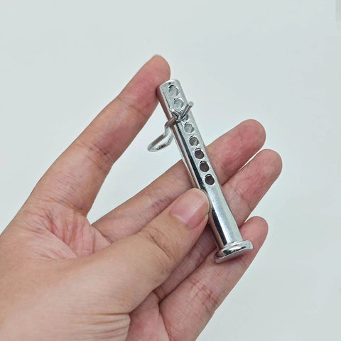 Hand holding heavy duty adjustable clevis pin with R clip set three eighths inch diameter and two and one half inches length eight position holes