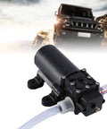 Heavy Duty 12V Auto Car Oil Extraction Pump Kit showing motor and tube for fluid transfer in an outdoor setting.