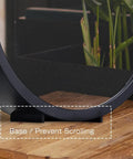 Base of Infinity Mirrors Tunnel Lights LED Night Light 3D Wall Lamp on a wooden tabletop with plants in the background.