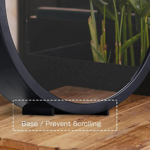 Base of Infinity Mirrors Tunnel Lights LED Night Light 3D Wall Lamp on a wooden tabletop with plants in the background.