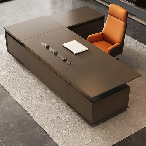 Level Up Your Daily Grind With This Elite Adjustable Standing Computer Desk Premium Executive Boss Table For Home Office Workstation Ergonomic Setup For Power Users And Heavy Lifts, large motorized desk with brown finish and orange chair.