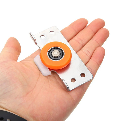 Hand holding component of Full Extension Drawer Slides Set With Door Pulley for Sliding Cabinets, featuring quiet tandem rollers
