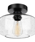 Heavy Duty Industrial Semi Flush Mount Ceiling Light With Tough Matte Black Frame And Authentic Seeded Glass Cover For A Big Time Modern Vintage Lighting Glow, round seeded glass and black frame.