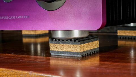 Cork Isolation Pads For Turntables, 1 Inch Thick, Pack Of 4, installed under a turntable for sound dampening on wood surface.
