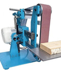 Badass 1100W Brushless Grinder And Polisher With Swappable Orientation Belt Sander showing belt sander with wood piece.
