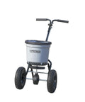 Beast 50 Lb Walk Behind Spreader For Lawn Care with durable composite hopper, rugged tires, and easy-grip handle.