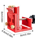Pro Shop Adjustable Pocket Hole Jig Machined From Rugged Aluminum Alloy measuring 9cm, red body with brass knobs for woodworking.
