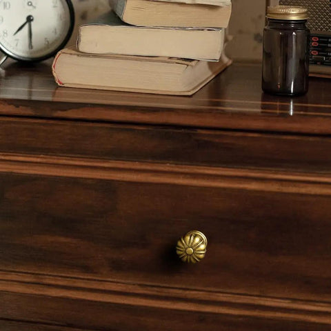 Set Of 12 Rustic Floral Antique Brass Cabinet Knobs For Kitchen Drawers installed on a wooden drawer in a farmhouse style room