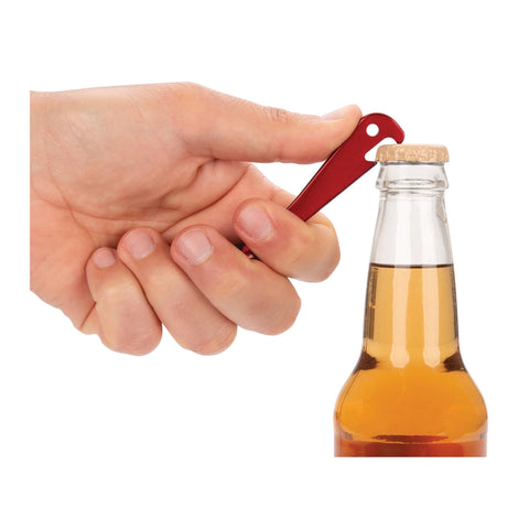 Hand using Quarter Inch Drive Anodized Stainless Steel Ratchet With 72 Tooth Gear, Key Ring Tool, Bottle Opener in red.