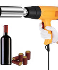 Portable Bottle Cap Sealer With Nine Adjustable Heat Settings For Perfect Wine Sealing, held above a wine bottle and caps.