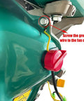 Close-up of Red On Off Engine Stop Switch 0G9911 installation in generator, showing three-wire connection and grounding instructions.