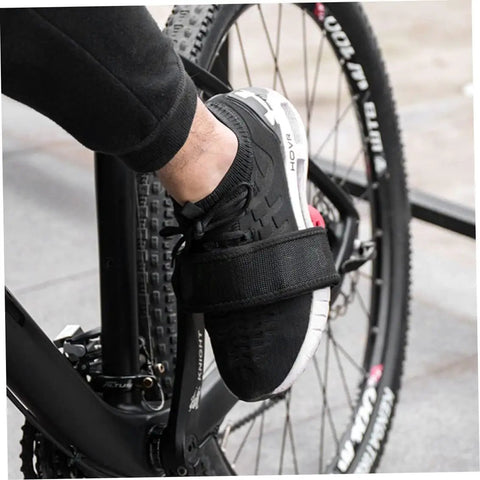 Cyclist using 2 Pcs Black Bike Pedal Straps With Toe Clips for Fixed Gear Bikes and Standard Pedals, non-slip adjustable nylon straps.
