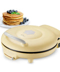 Bear 11.8 Inch 1500W Electric Smokeless Indoor Grill With Adjustable Temp Control Nonstick Pan making pancakes with blueberries.
