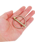 Heavy Duty Lynch Pin 8 Pack Kit for Trailers Trucks and Mowers Galvanized Safety Pins to Lock Hitches Secure Gear and Keep Your Rig Ready on Vehicles and Attachments, galvanized lynch pin in hand