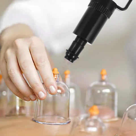 Universal Replacement Manual Cupping Pump With Ergonomic Grip For Vacuum Cups in use with glass cup and handle attachment