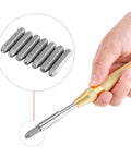Hand holding automatic punch tool from 38 Piece Metal Stamping Kit With Automatic Letter And Number Punch Set For Leather, Wood, And Jewelry Making.