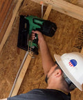 Worker using 18V MultiVolt Cordless Framing Nailer Kit with 30-Degree Magazine for construction